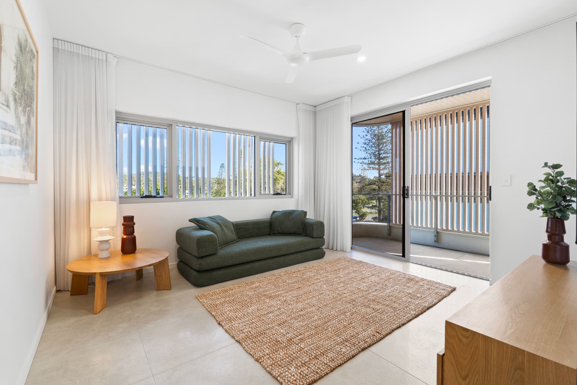 Light-filled living room opening onto a private balcony